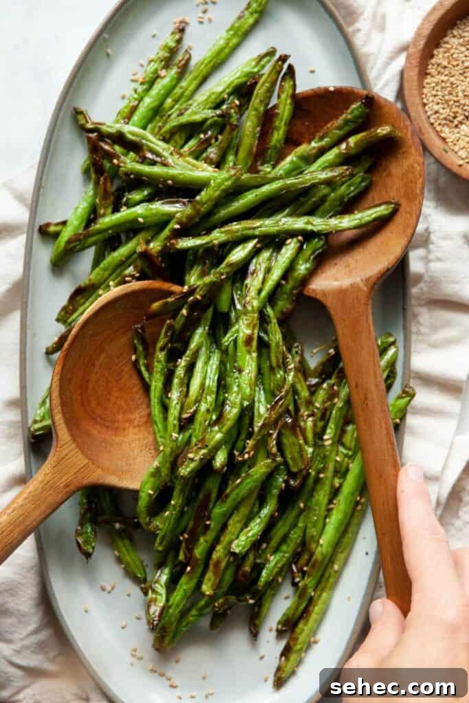 Crispy Air Fryer Green Beans: 4 Flavorful Recipes 2 close up of air fryer green beans on a serving platter