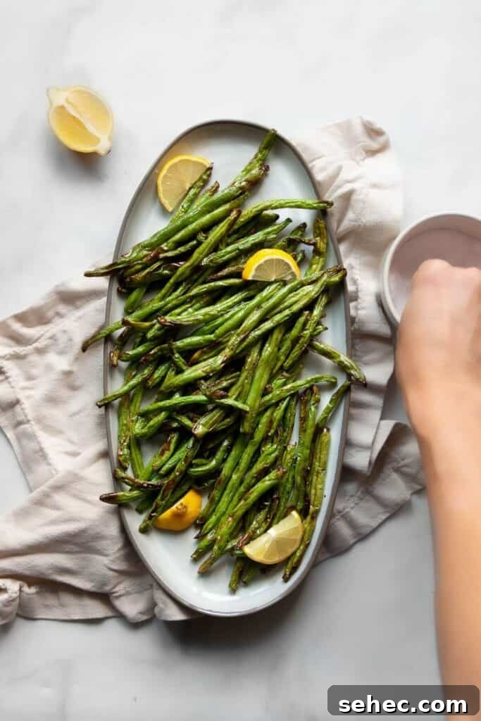 Crispy Air Fryer Green Beans: 4 Flavorful Recipes 3 lemon garlic air fryer green beans on a serving platter