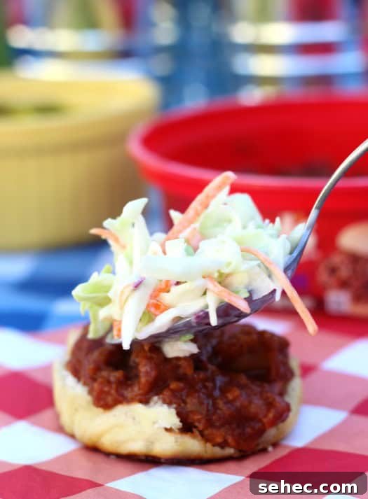 Adding coleslaw to a pulled pork slider adding coleslaw to a pulled pork slider roll