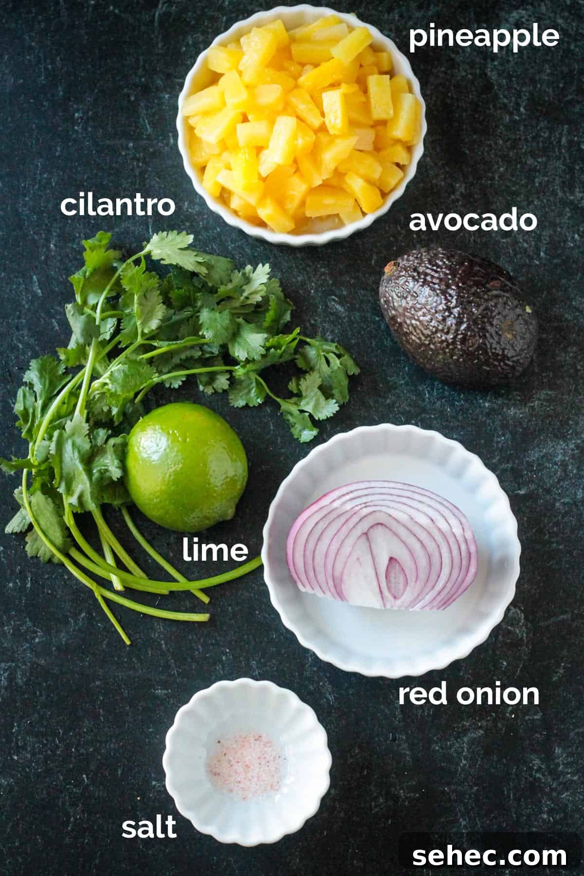 Fresh Pineapple and Avocado Salsa with Lime 3 Recipe ingredients arrayed in individual bowls.