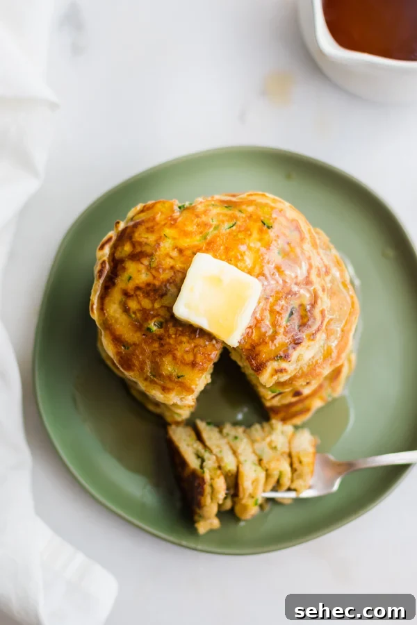 Fluffy Zucchini Bread Pancakes Recipe 10 A top down view of the stack of pancakes.